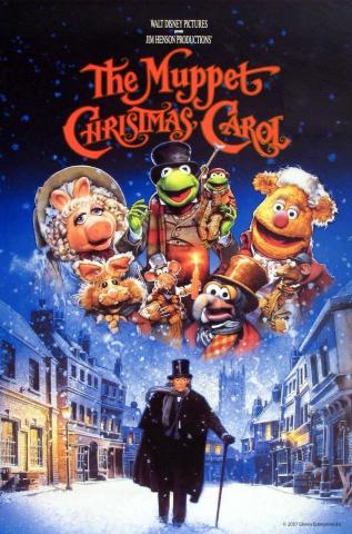 An image of a man in a coat and top hat walking down a snow covered street with the Muppets in holiday costumes above. The words The Muppet Christmas Carol are on top..