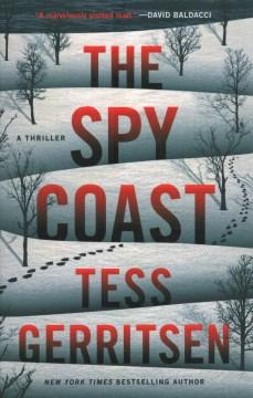 Cover of The Spy Coast featuring a snow covered hill with trees and a trail of footprints