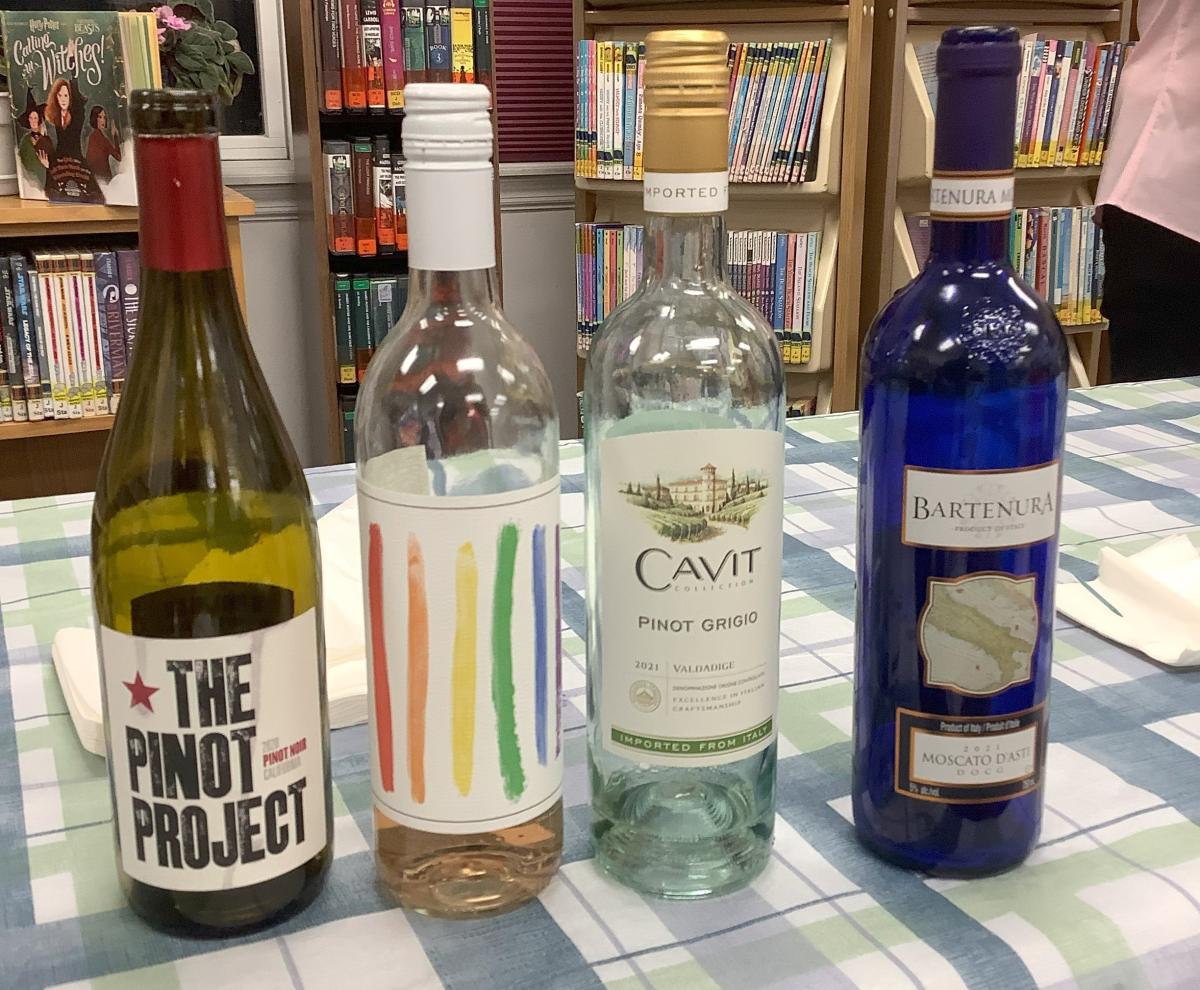 Four bottles of wine on a table